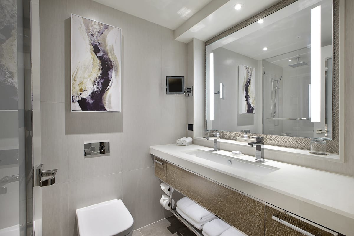 designer toiletries, hair dryer, bathrobes, towels