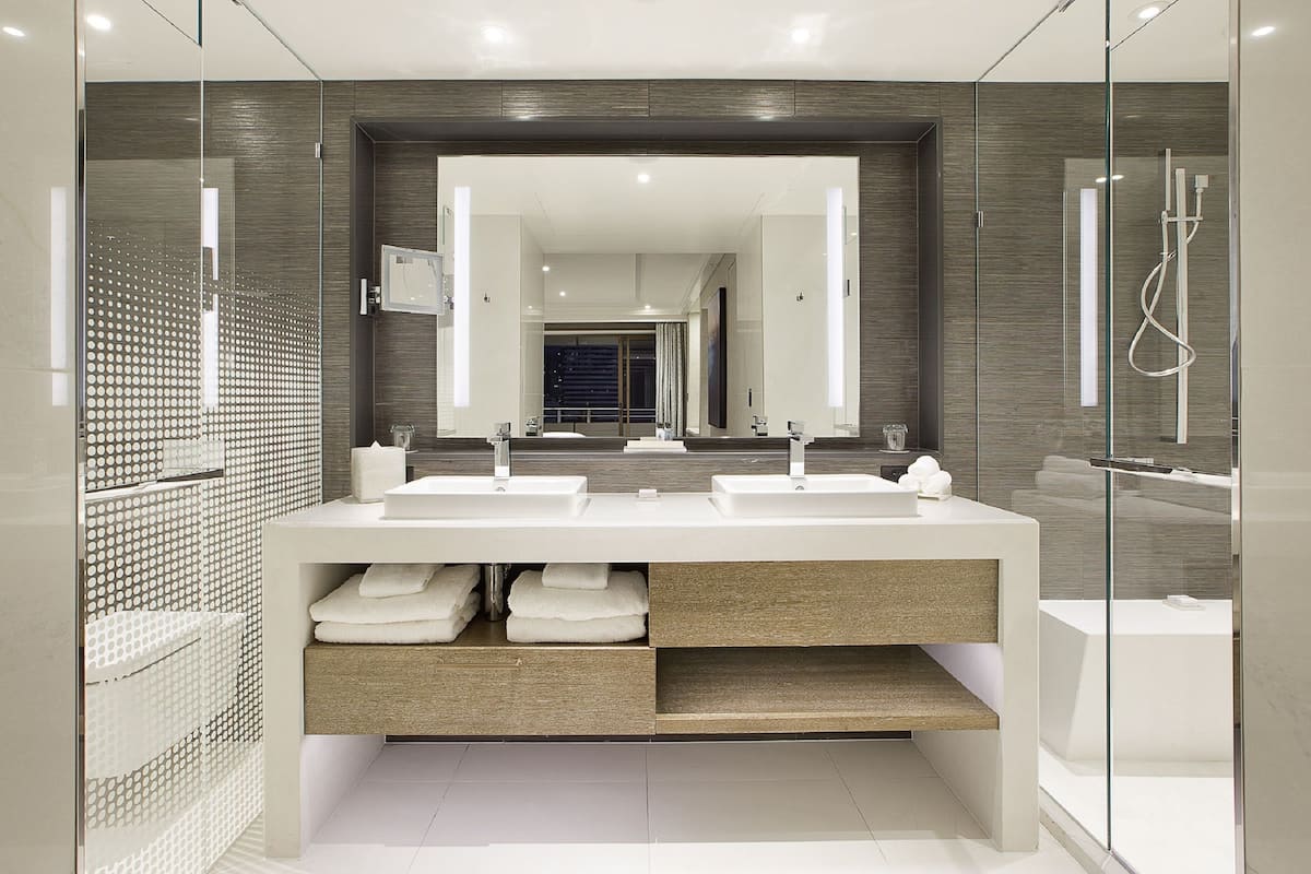 club suite | bathroom | designer toiletries, hair dryer, bathrobes, towels