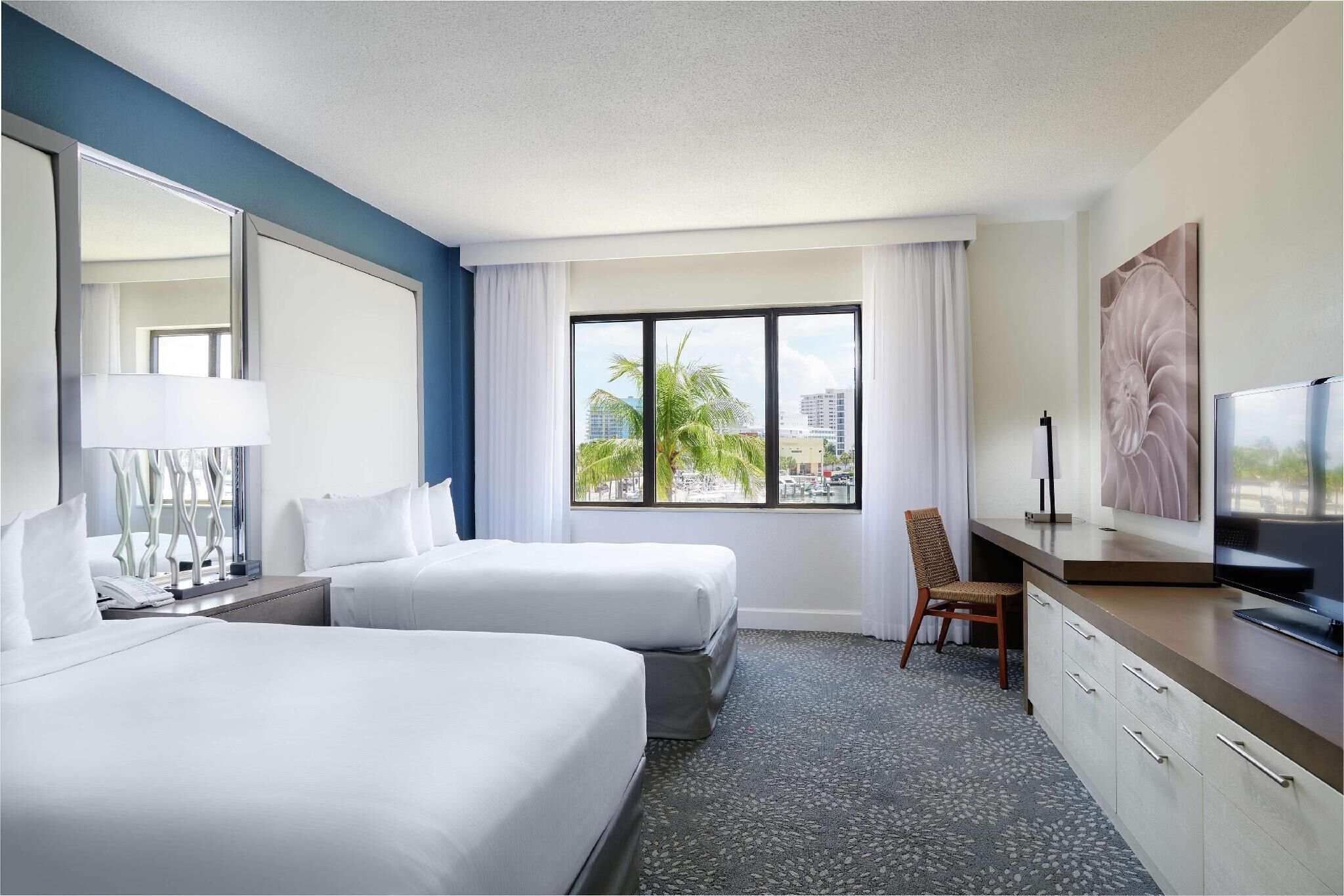 Down comforters, pillowtop beds, in-room safe, desk