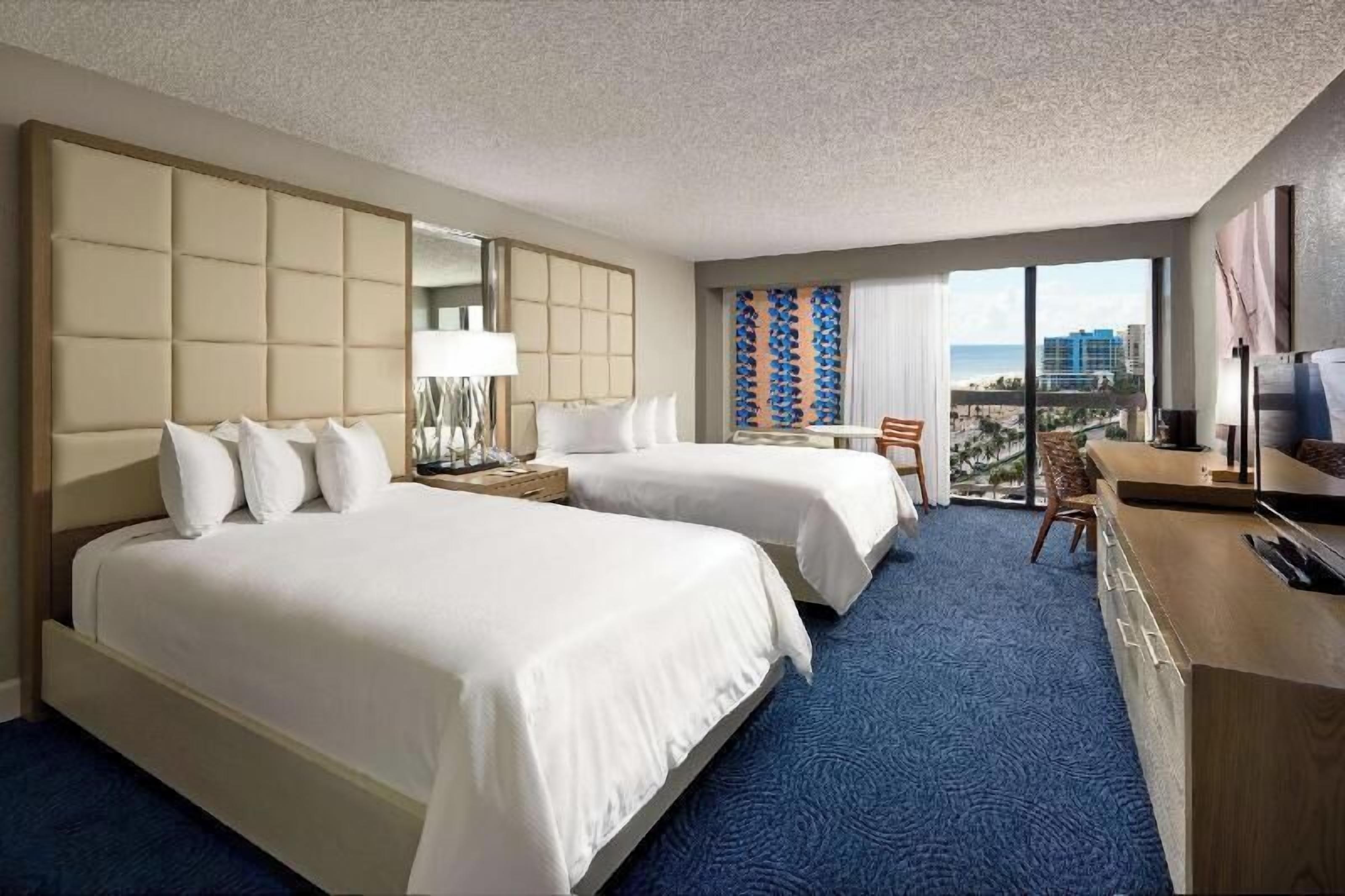 Down comforters, pillowtop beds, in-room safe, desk