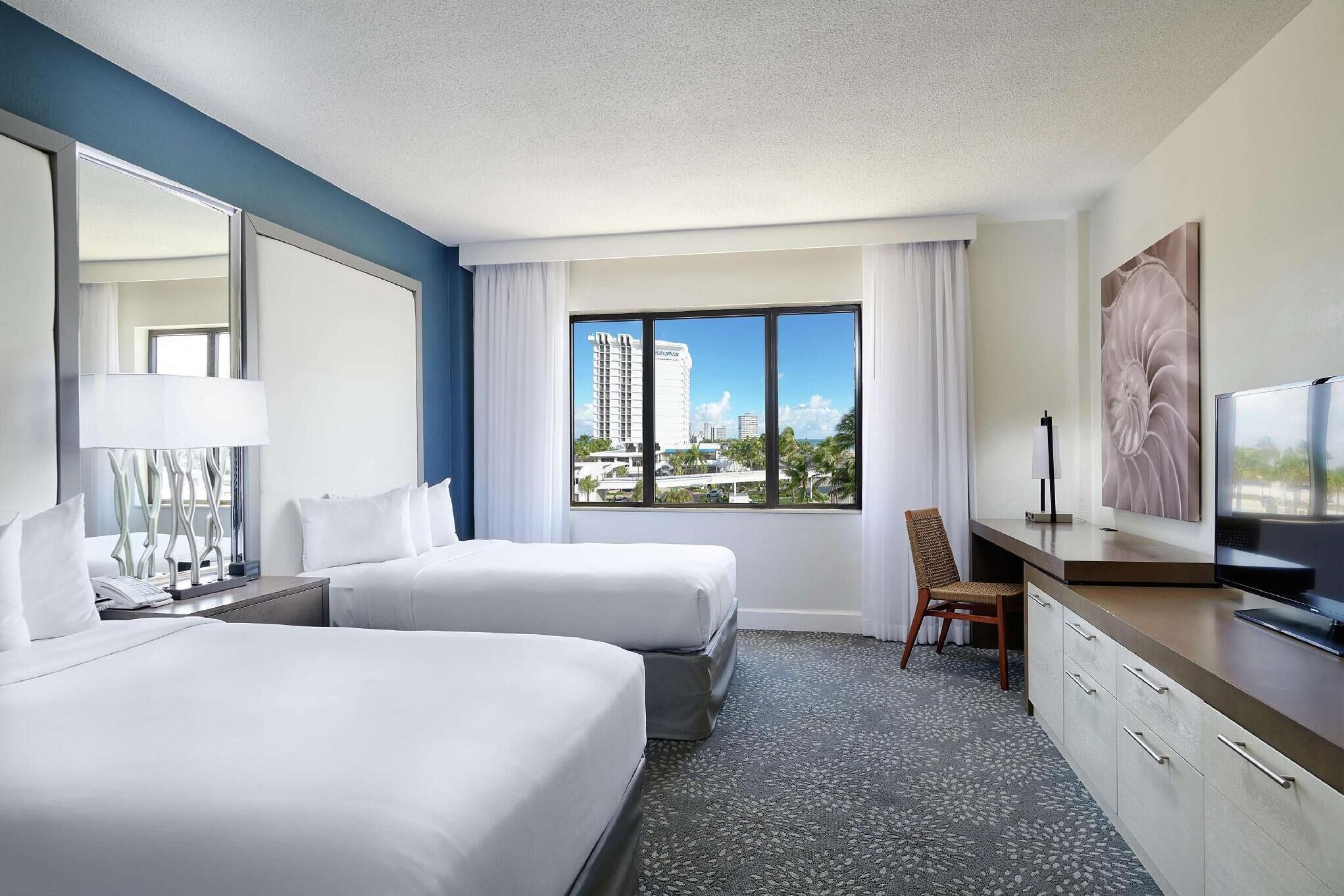 Down comforters, pillowtop beds, in-room safe, desk