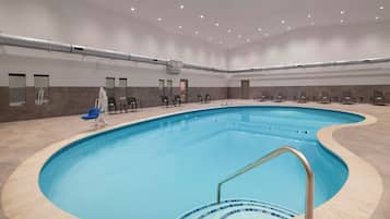Indoor pool, open 9:00 AM to 10:00 PM, pool loungers