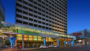 Experience the hotel's unique architectural design, featuring a series of balconies and a large glass facade.
