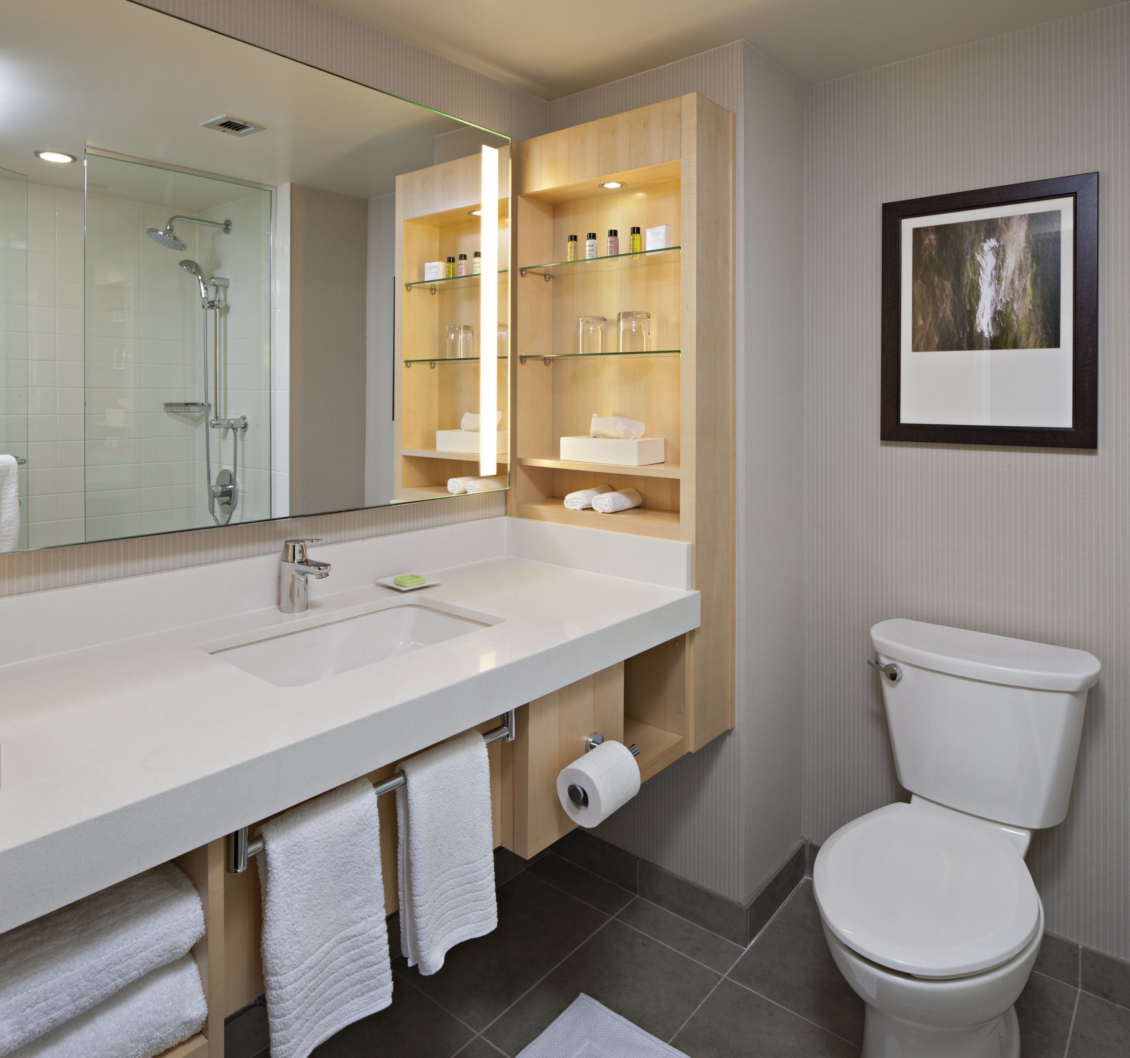 combined shower/bathtub, designer toiletries, hair dryer, heated floors