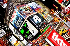 A busy urban street with various storefronts and billboards. - The Lombardy Hotel (New York)