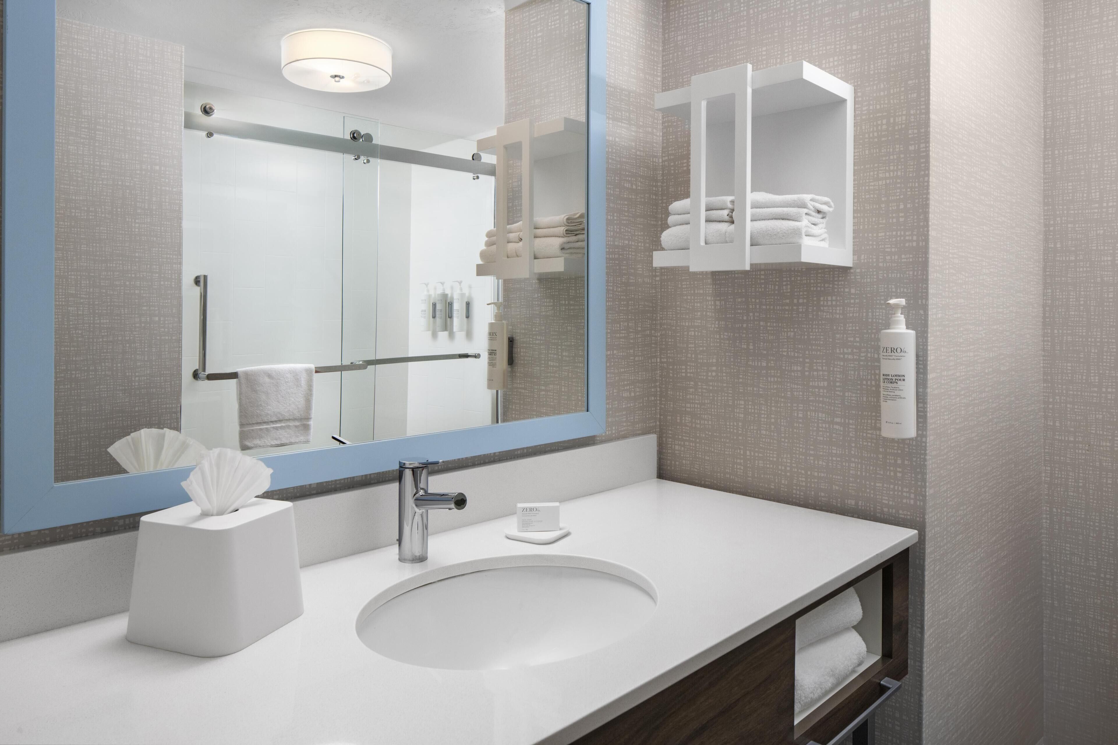 eco-friendly toiletries, hair dryer, towels, soap