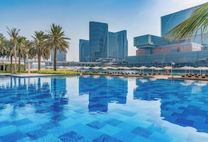 Outdoor pool, open 7:00 AM to 7:00 PM, pool umbrellas, pool loungers