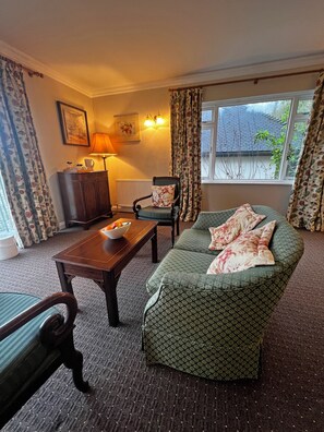 Studio, River View | Living area | LCD TV