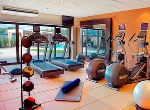 A gym with treadmills, elliptical machines, and free weights. - DoubleTree by Hilton Monrovia - Pasadena Area (Monrovia)