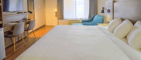 Desk, laptop workspace, blackout drapes, iron/ironing board