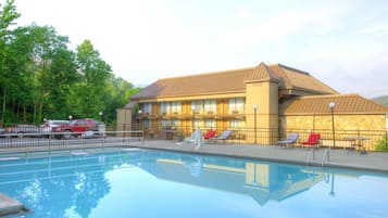 Seasonal outdoor pool, open 9:30 AM to 10:00 PM, pool umbrellas