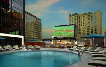 Outdoor pool, open 7:00 AM to 10:00 PM, pool loungers