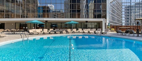 Outdoor pool, open 7:00 AM to 10:00 PM, pool loungers