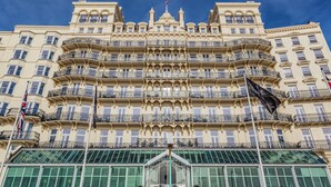 A grand hotel with multiple balconies, large windows, and a prominent entrance.
