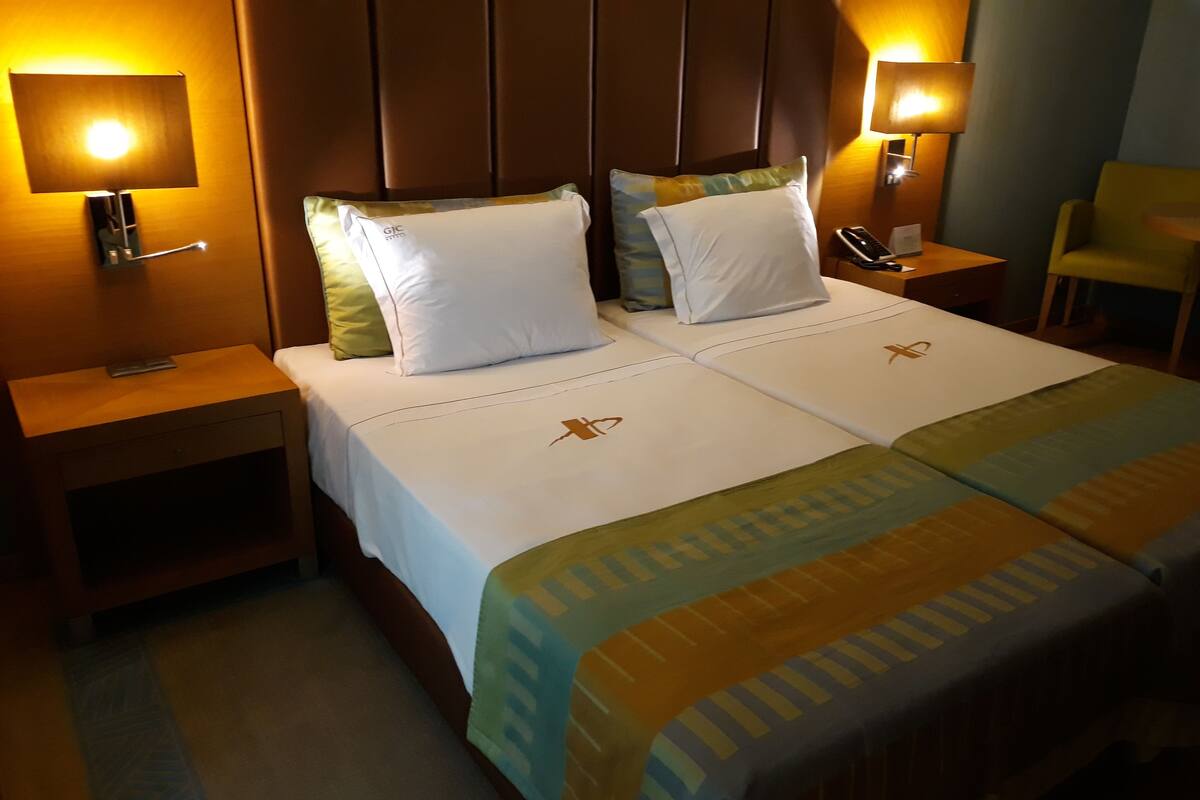 Deluxe Twin Room, 2 Twin Beds, Kitchenette, City View | Minibar, in-room safe, desk, soundproofing