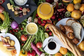 A variety of food items including fruits, vegetables, bread, and a jug of juice. - Kyoto Tokyu Hotel (Kyoto)