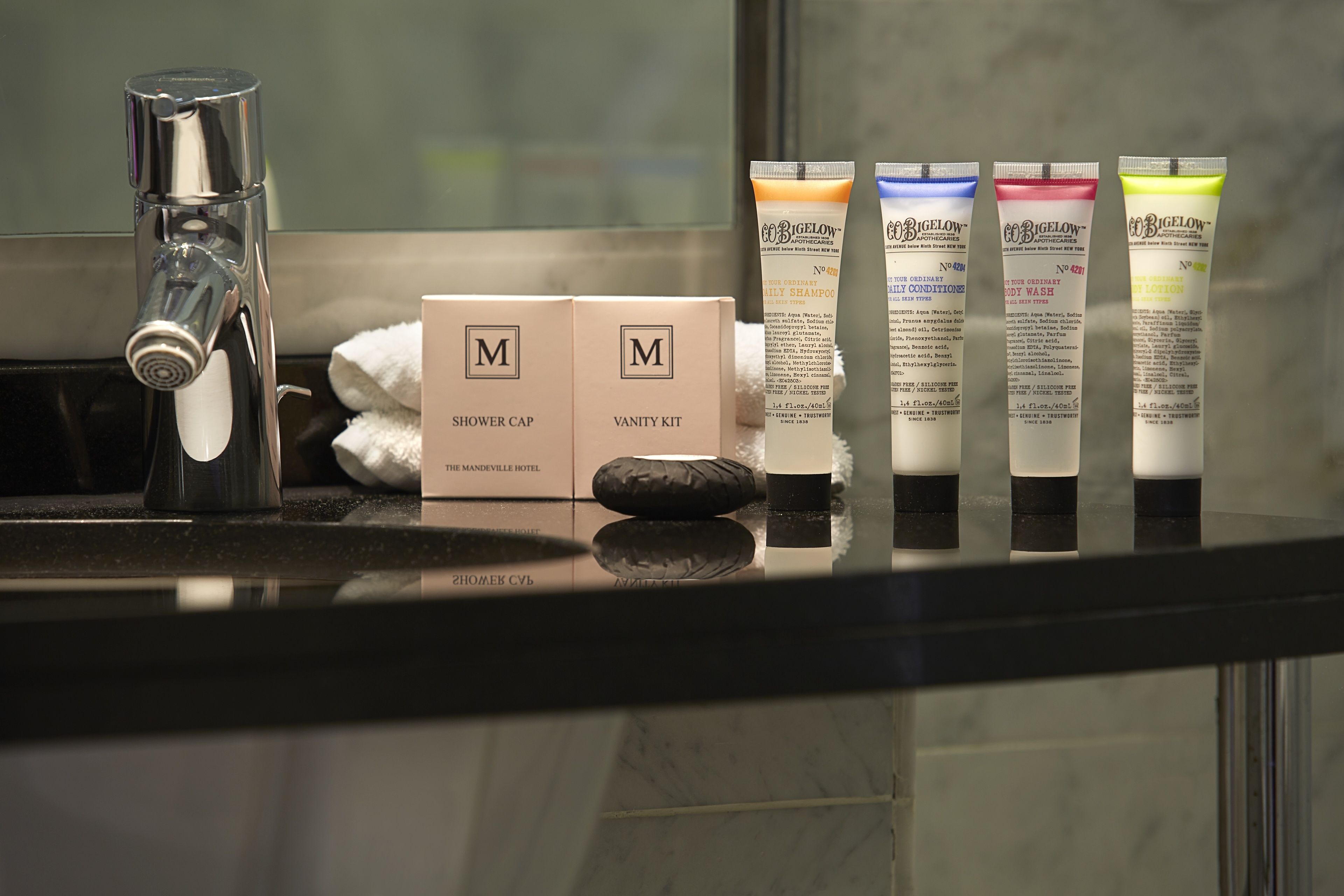 combined shower/bathtub, designer toiletries, hair dryer, slippers