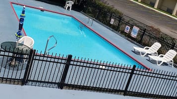 Seasonal outdoor pool, pool loungers