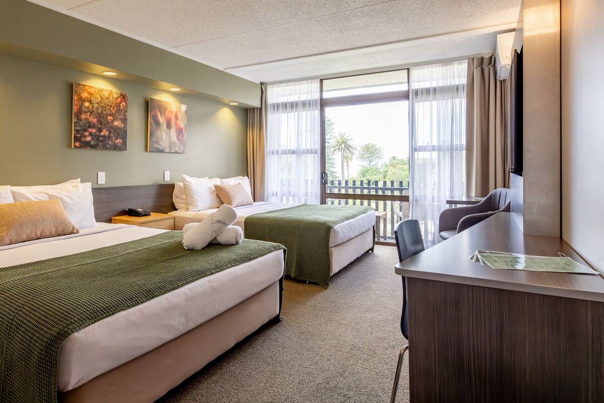Superior Twin Queen with Balcony | 1 bedroom, desk, blackout curtains, iron/ironing board