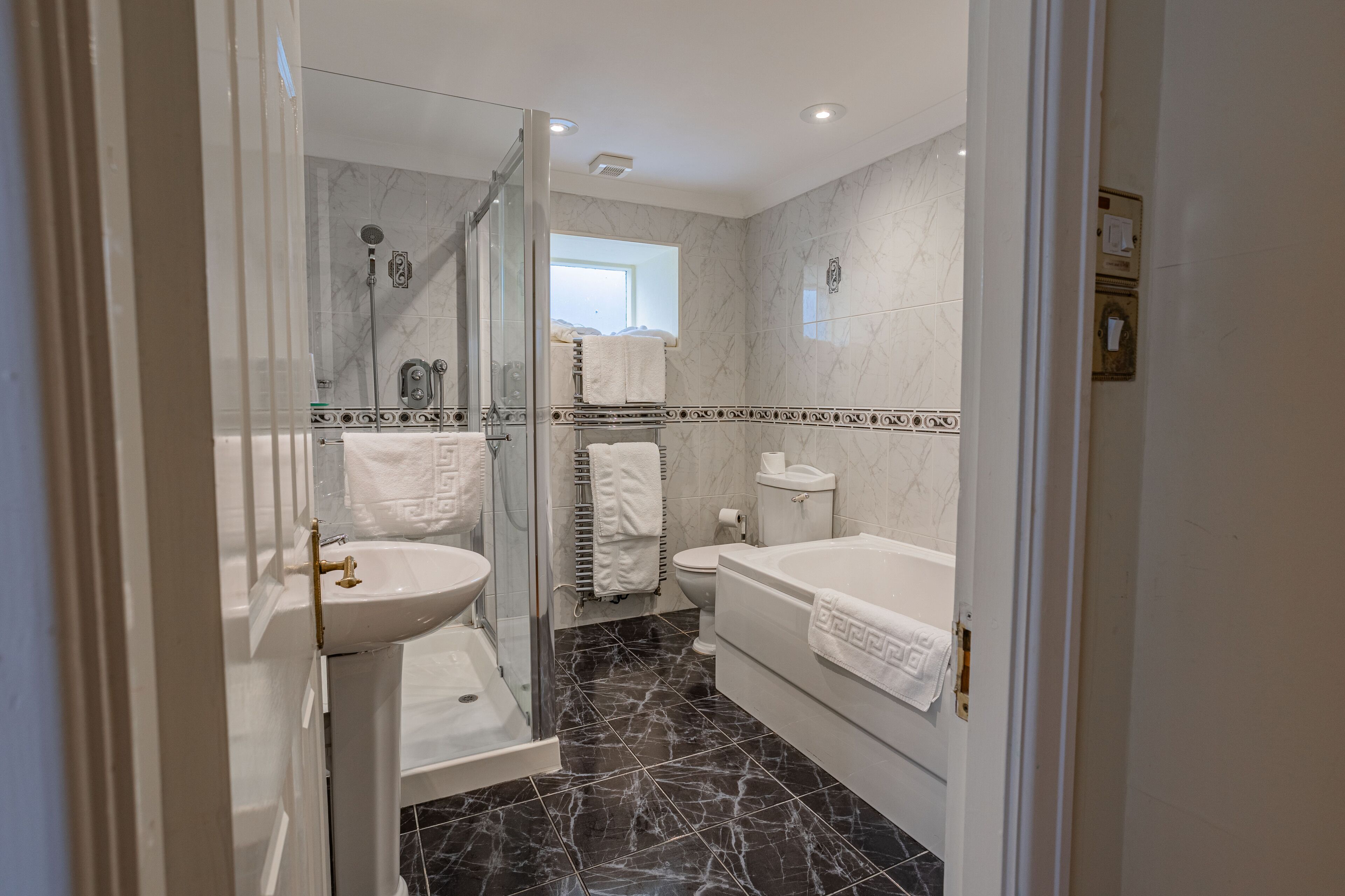 junior suite with outdoor seating | bathroom | combined shower/bathtub, hair dryer, towels