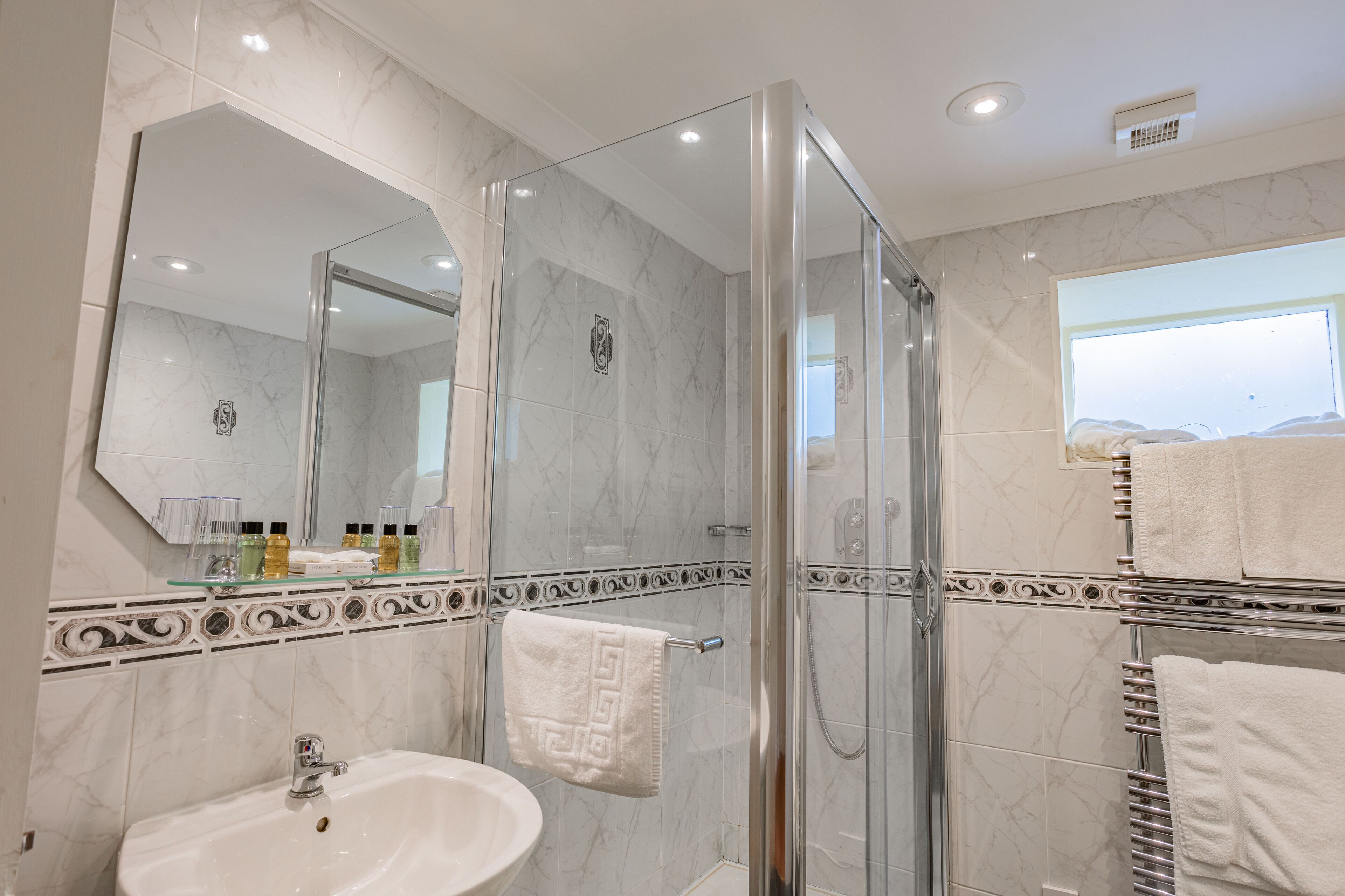 junior suite with outdoor seating | bathroom | combined shower/bathtub, hair dryer, towels