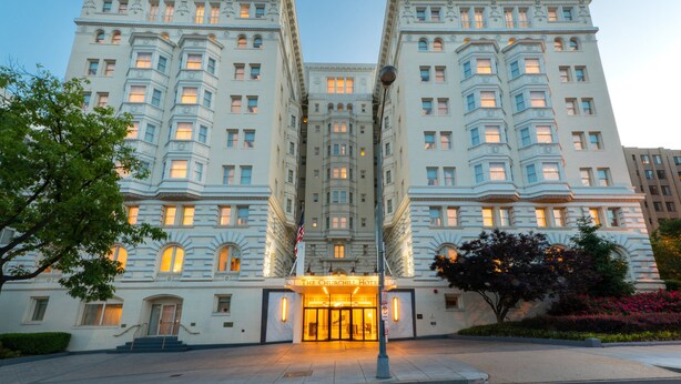 A large, historic hotel with a grand entrance, multiple floors, and classic architecture. - The Churchill Hotel near Embassy Row (Washington)