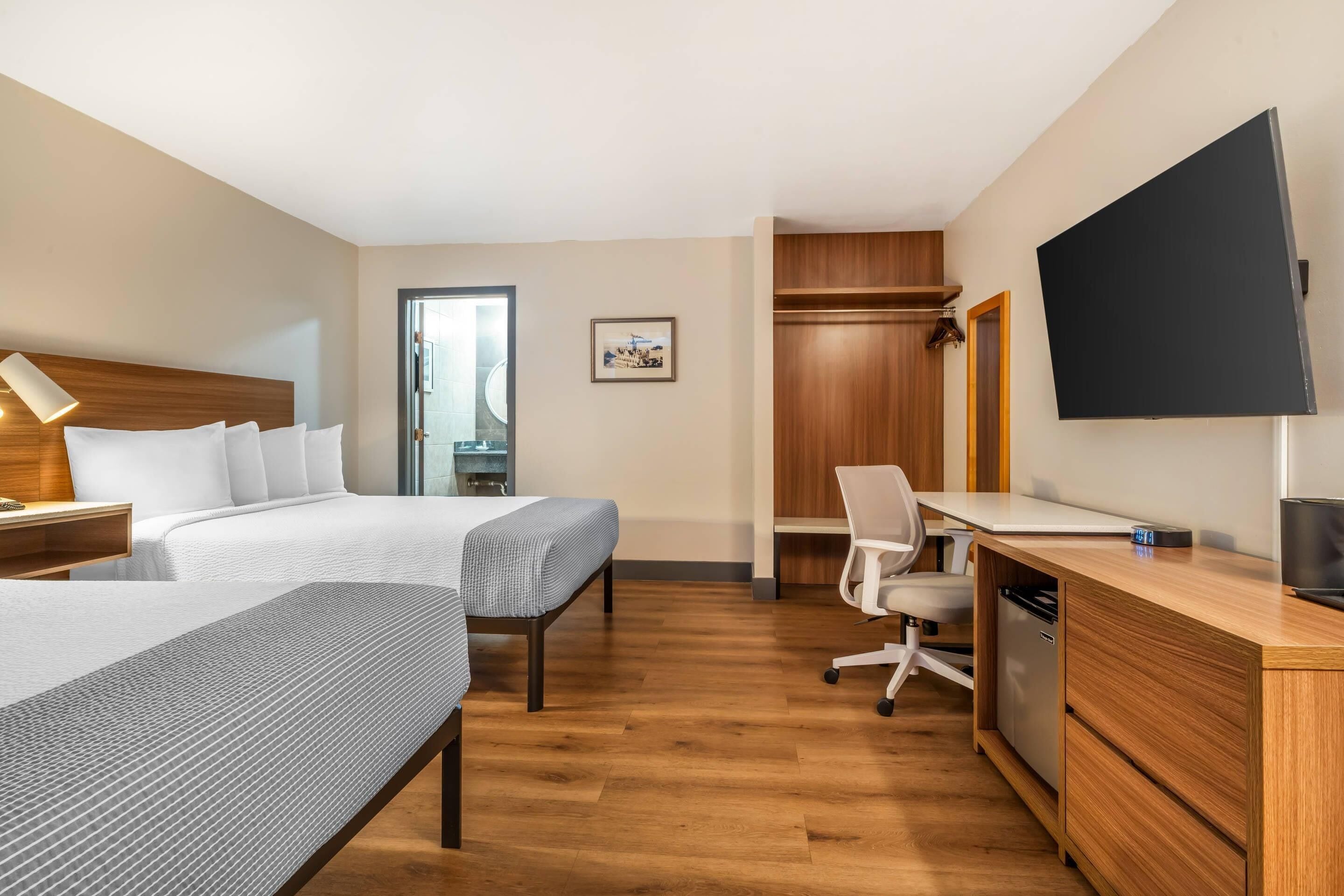 Pillow-top beds, desk, blackout curtains, iron/ironing board