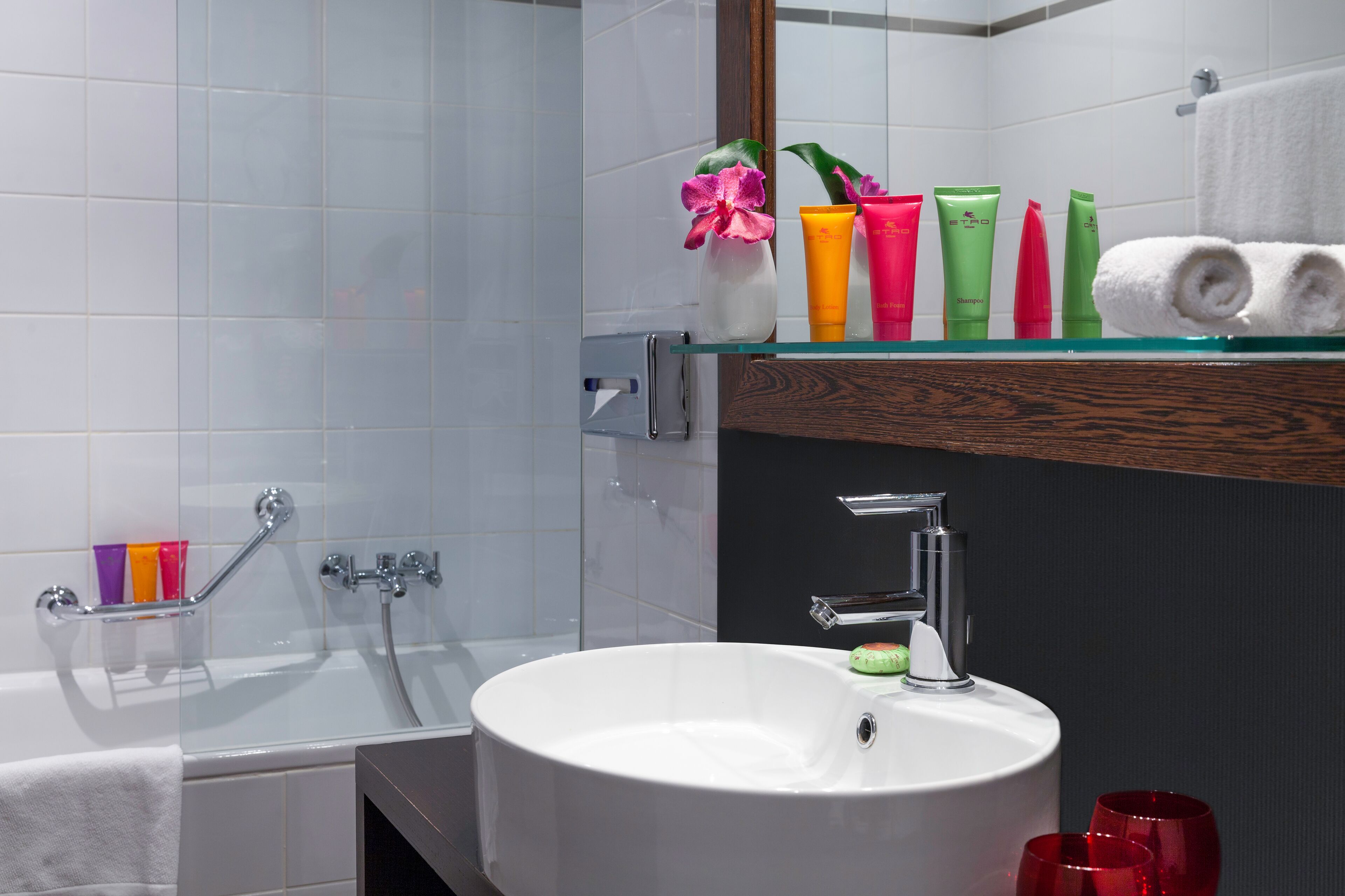 bathtub, eco-friendly toiletries, hair dryer, towels