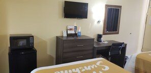 Desk, laptop workspace, blackout drapes, iron/ironing board