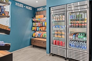 A snack and beverage vending area with various snacks and drinks.