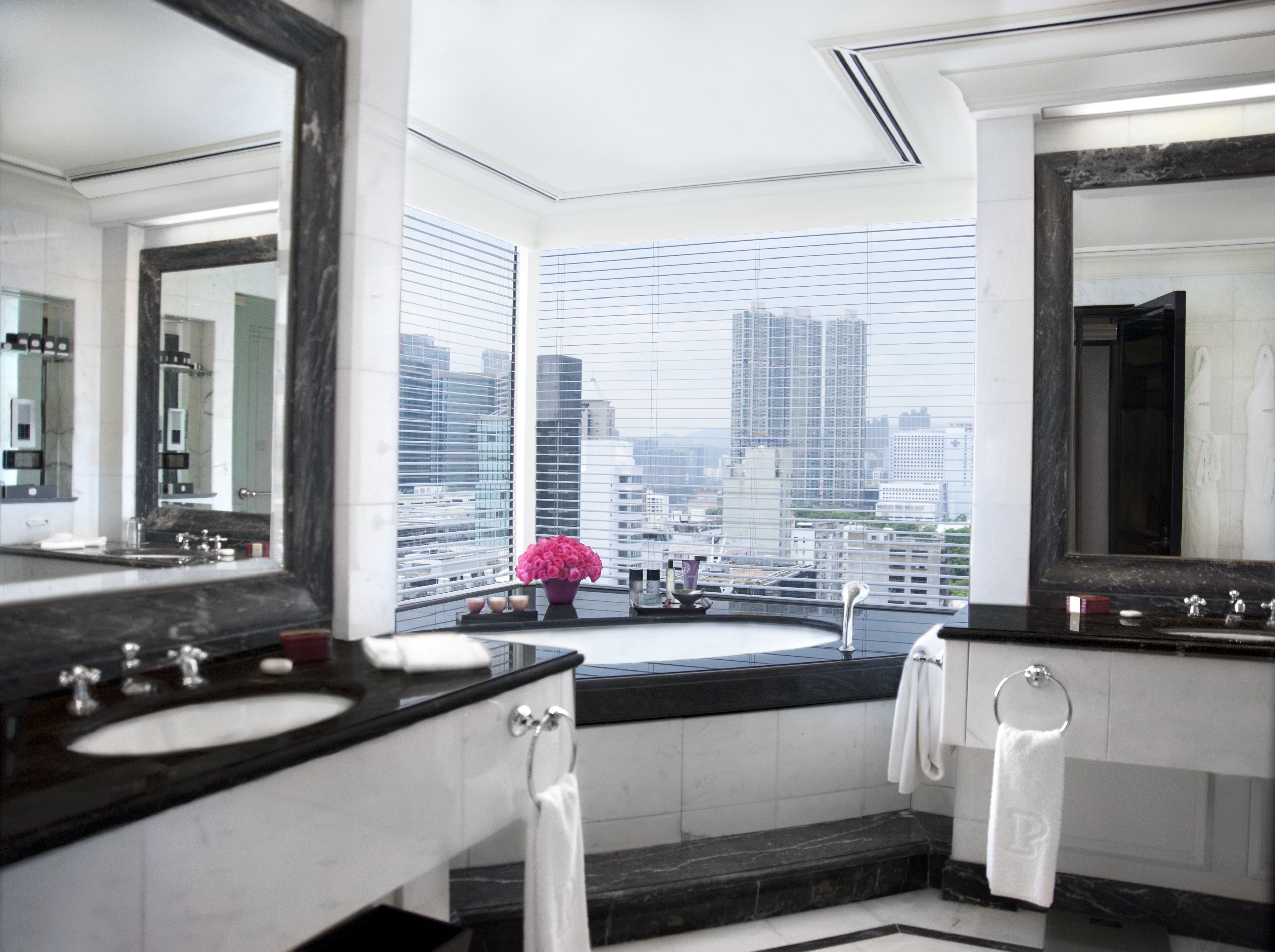 deluxe harbour view suite | bathroom | separate bathtub and shower, rainfall showerhead, designer toiletries