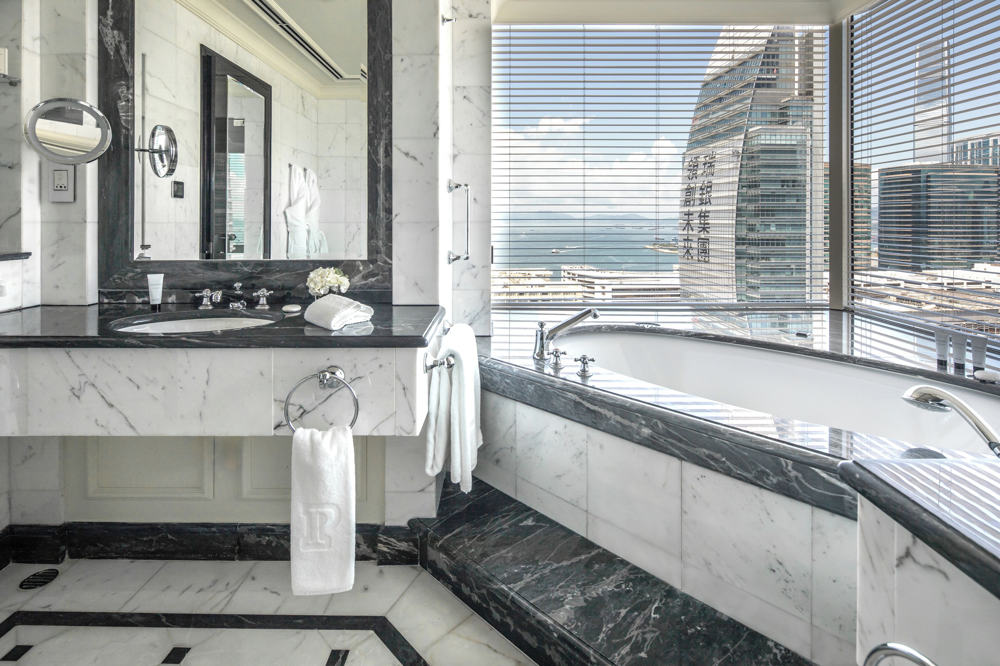 grand deluxe harbour view suite | bathroom | separate bathtub and shower, rainfall showerhead, designer toiletries