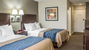 Premium bedding, desk, laptop workspace, blackout curtains