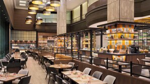 A modern restaurant with high ceilings, pendant lighting, and a central bar area. - JEN Singapore Tanglin by Shangri-La (Singapore)