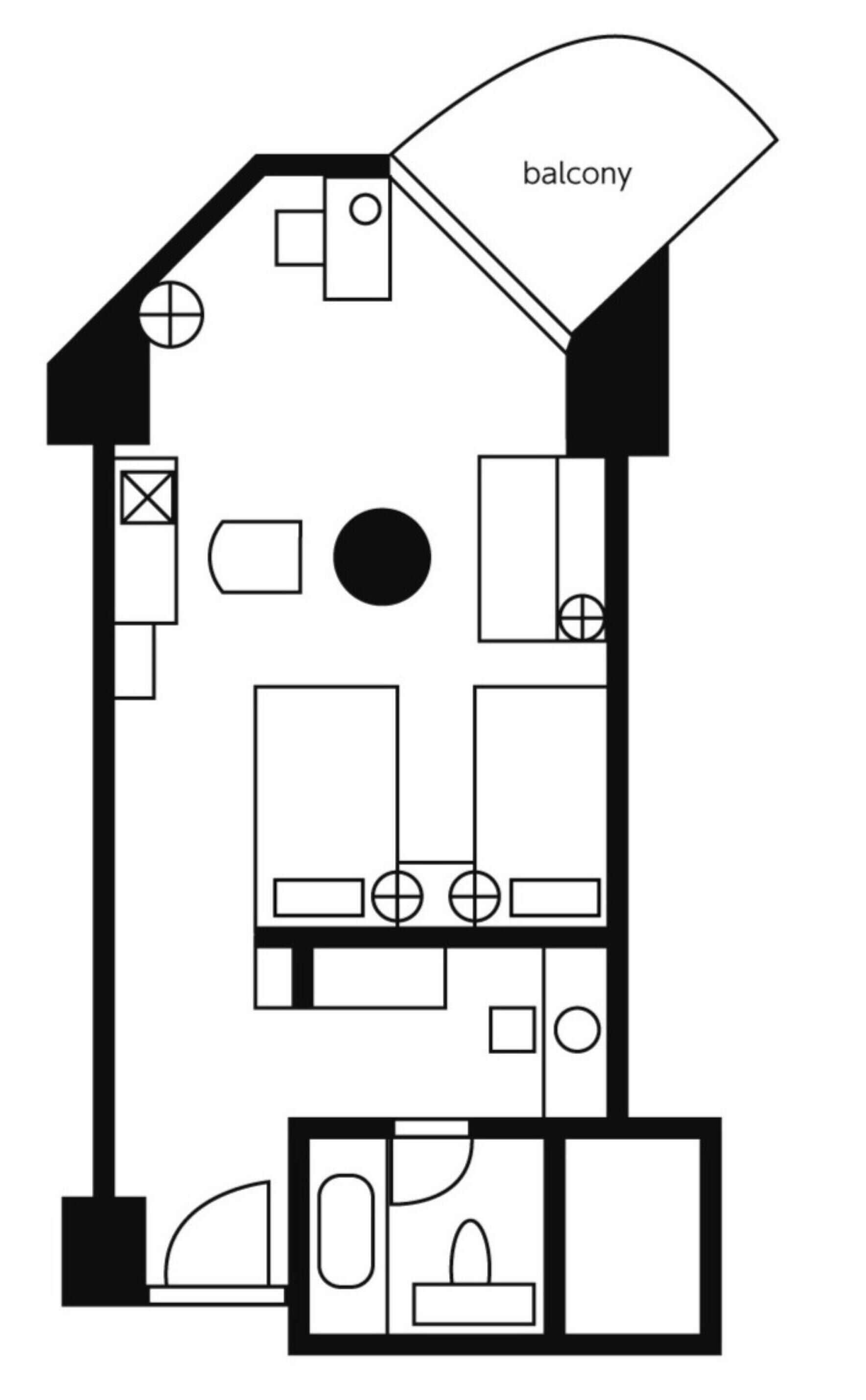 Un plan d’étage comprenant un balcon, un coin cuisine et un espace de vie.