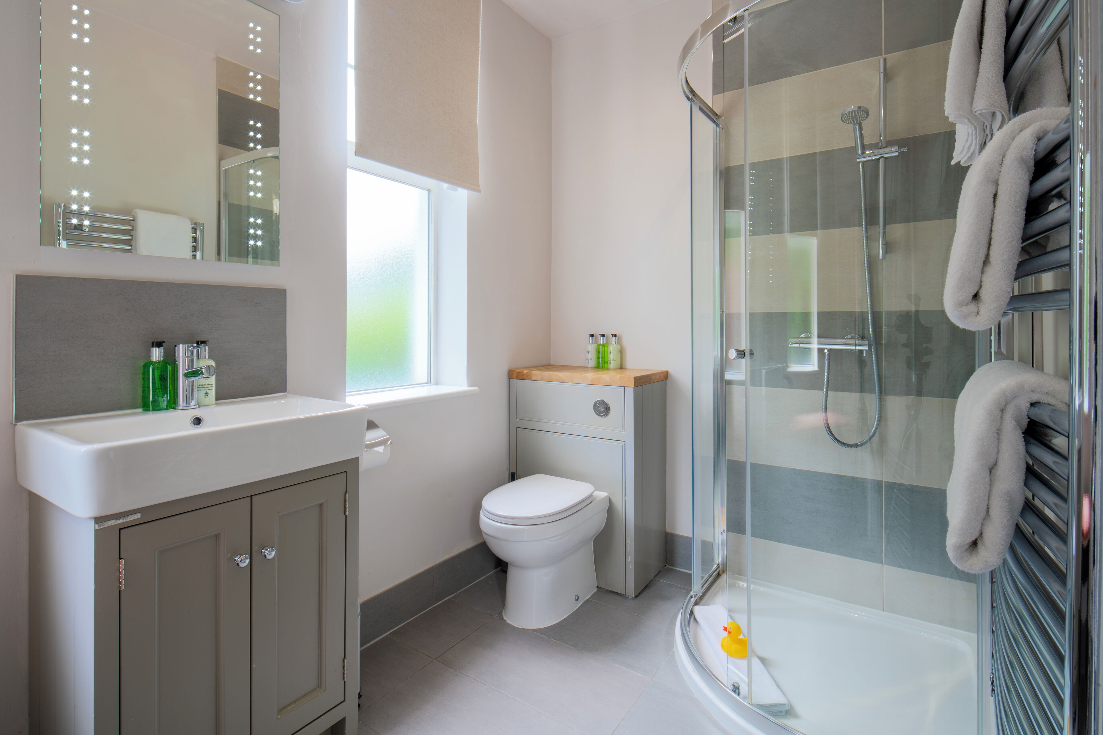 superior double room | bathroom | shower, eco-friendly toiletries, hair dryer, towels