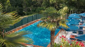 Seasonal outdoor pool, open 9:00 AM to 9:00 PM, pool umbrellas