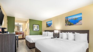 A hotel room with two beds, a desk, and a view of a lake. - Quality Inn Klamath Falls - Crater Lake Gateway (Klamath Falls)
