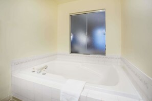 Suite, 1 Queen Bed, Non Smoking, Hot Tub | Bathroom | Combined shower/bathtub, eco-friendly toiletries, hair dryer, towels