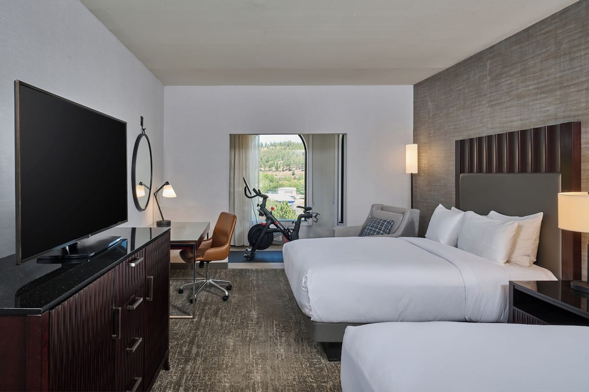 Room, 2 Queen Beds (with Peloton) | In-room safe, desk, blackout drapes, iron/ironing board