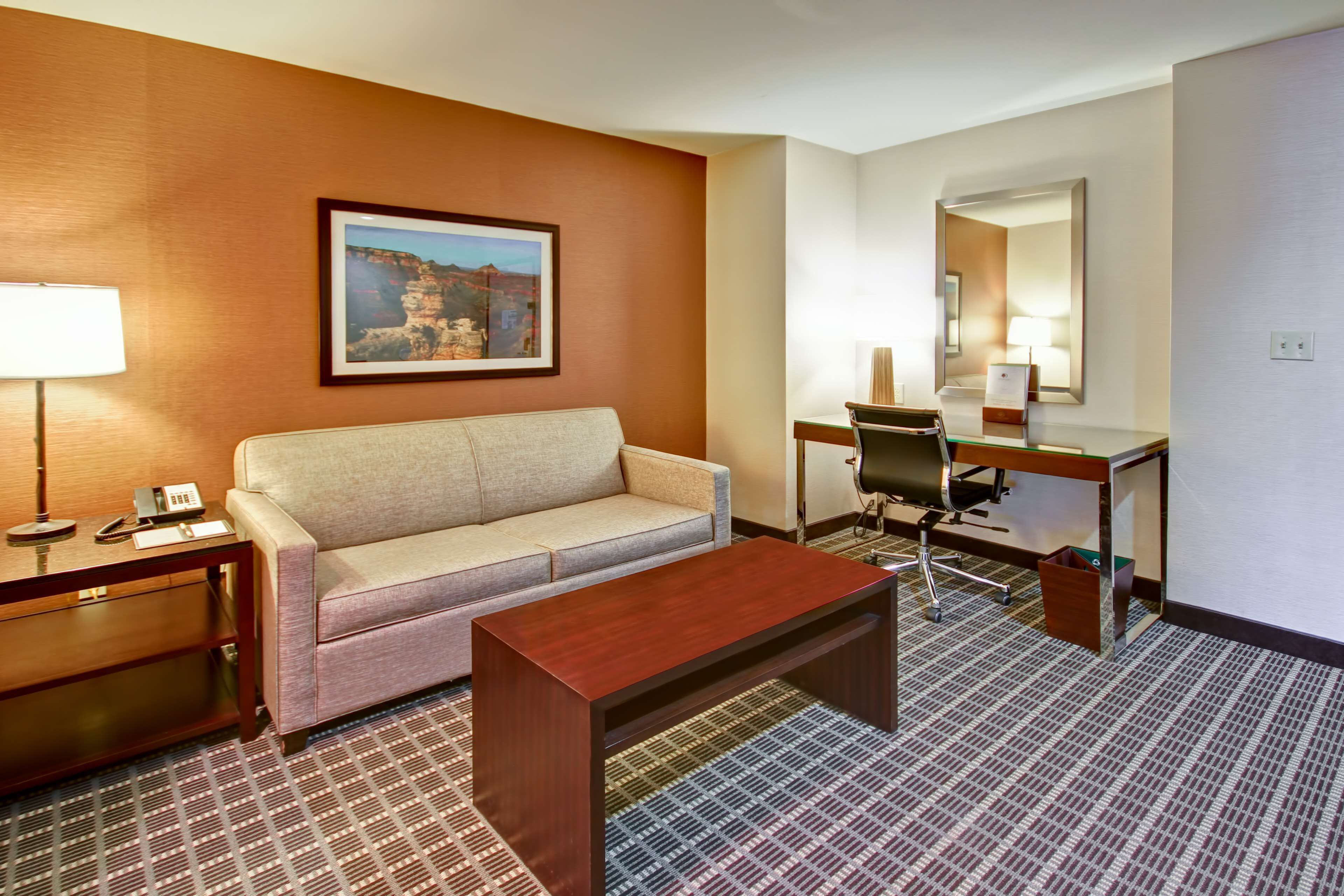 junior suite, 1 king bed | living area | 37-inch lcd tv with satellite channels, smart tv, mp3 dock