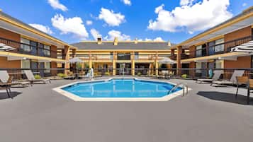 Seasonal outdoor pool, open 9:00 AM to 9:00 PM, pool umbrellas