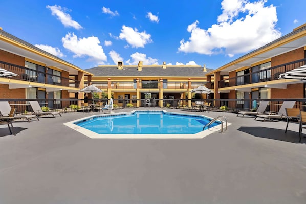 Seasonal outdoor pool, open 9:00 AM to 9:00 PM, pool umbrellas