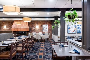 Enjoy a meal in our spacious dining area with a variety of seating options and a warm atmosphere.