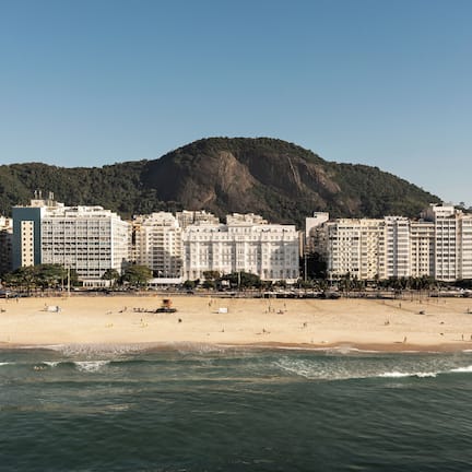 On the beach, white sand, sun loungers, beach towels
