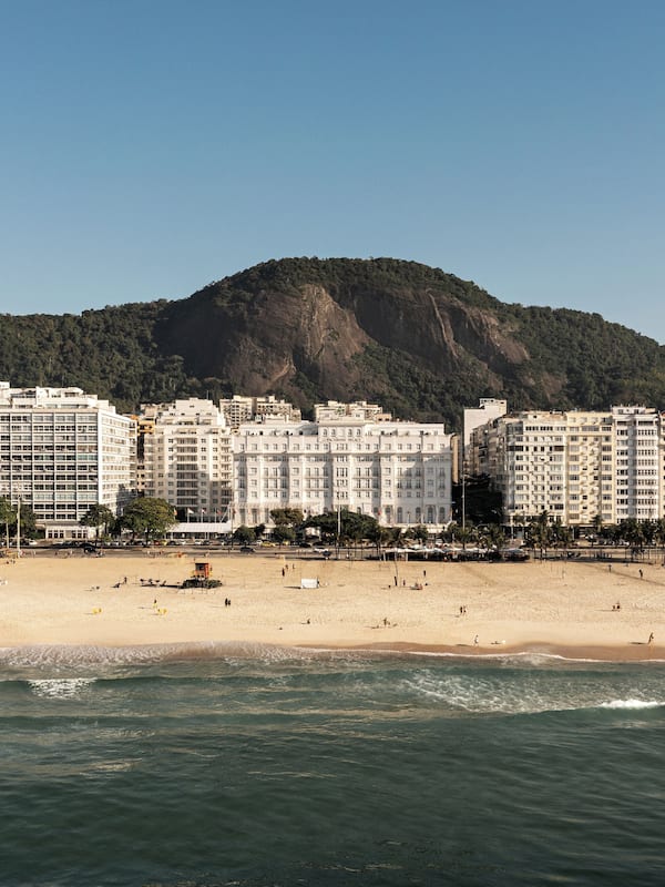 On the beach, white sand, sun loungers, beach towels