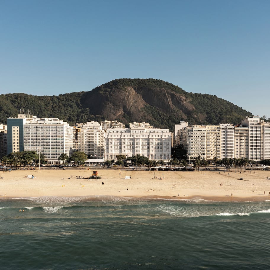 On the beach, white sand, sun loungers, beach towels