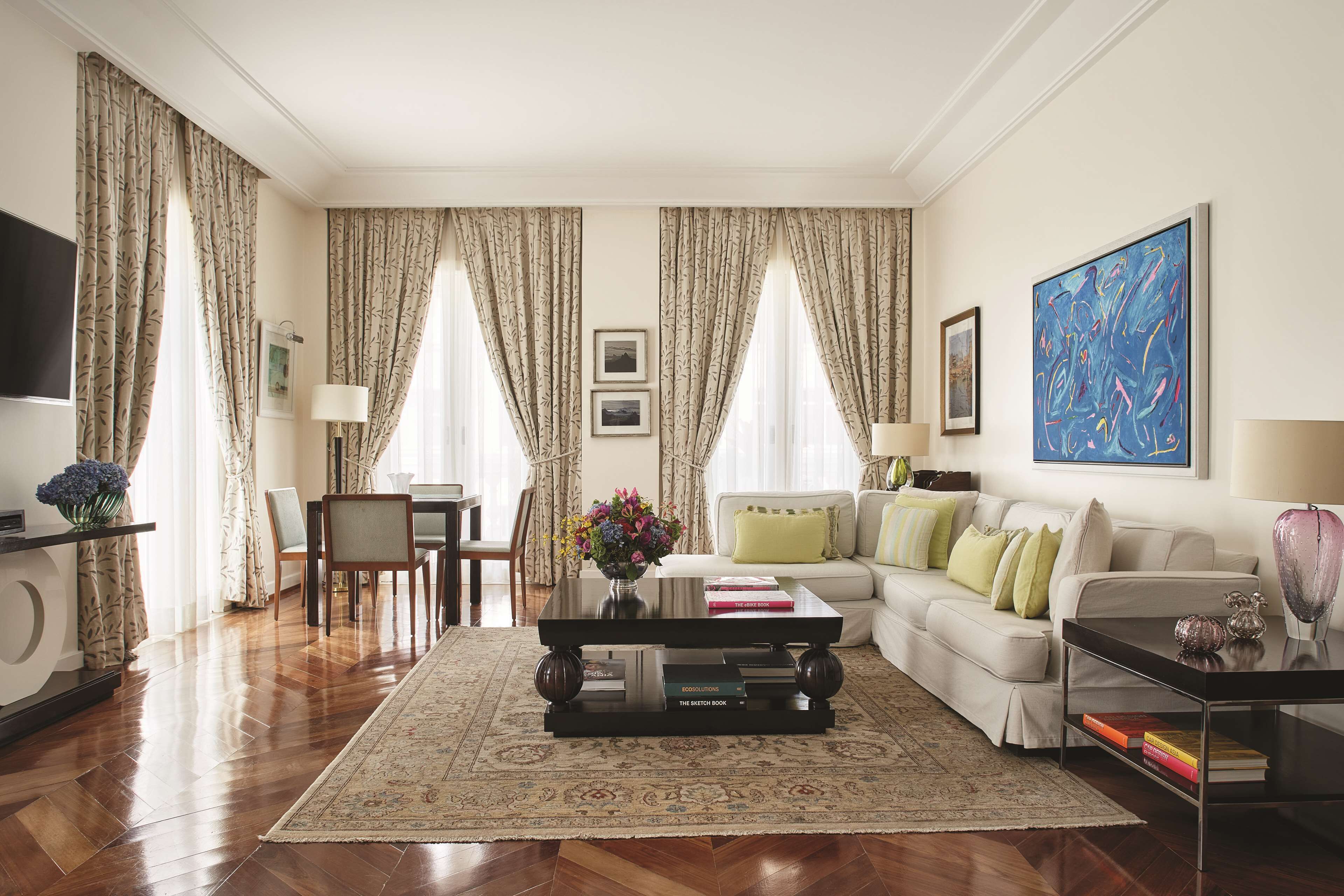 A living room with a sofa, coffee table, and a TV.