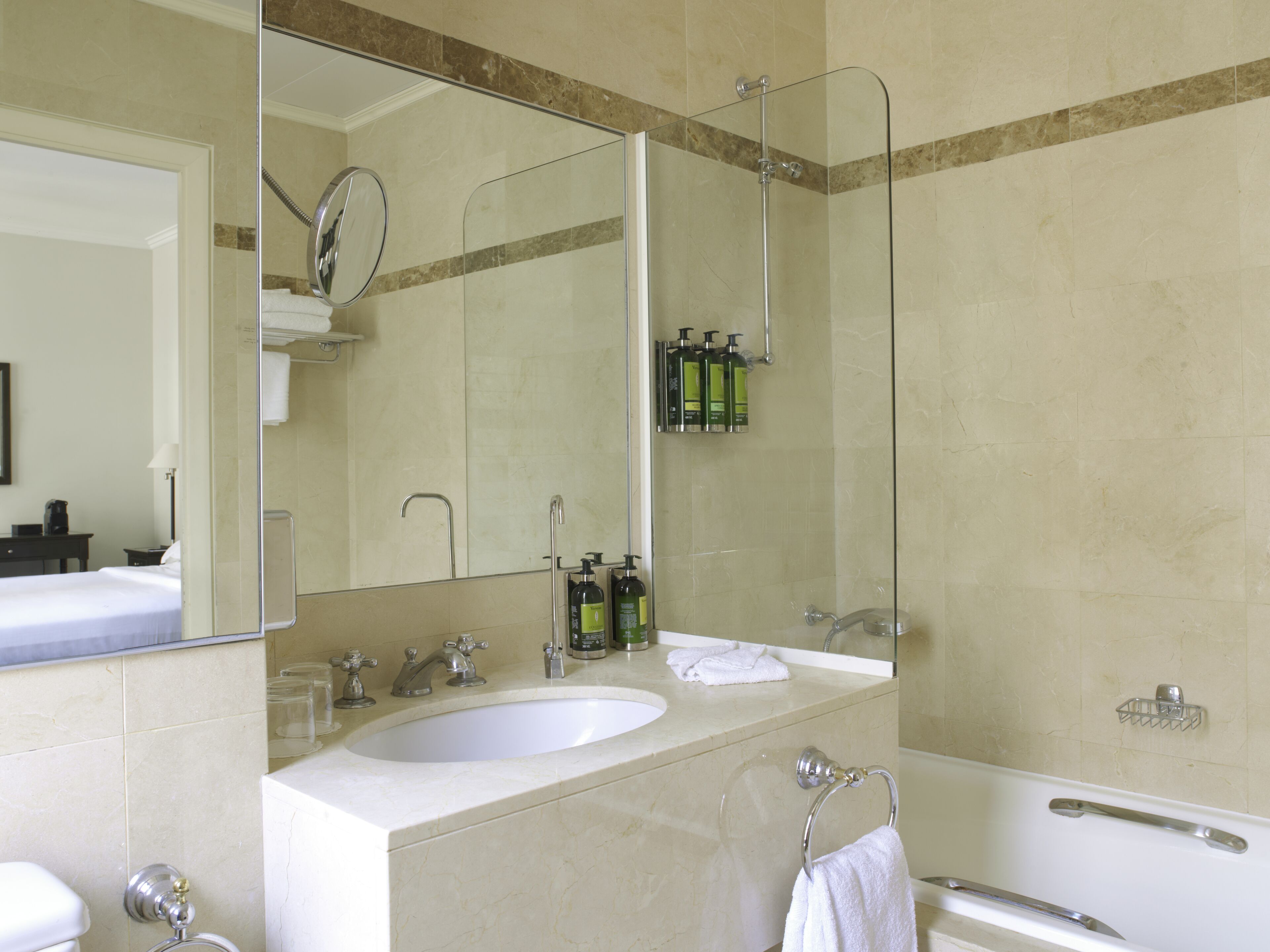 bathtub, designer toiletries, hair dryer, bathrobes