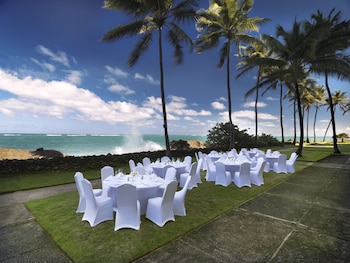 Enjoy a formal outdoor dining experience amidst lush surroundings and a serene ocean view. at The Condado Plaza Hotel